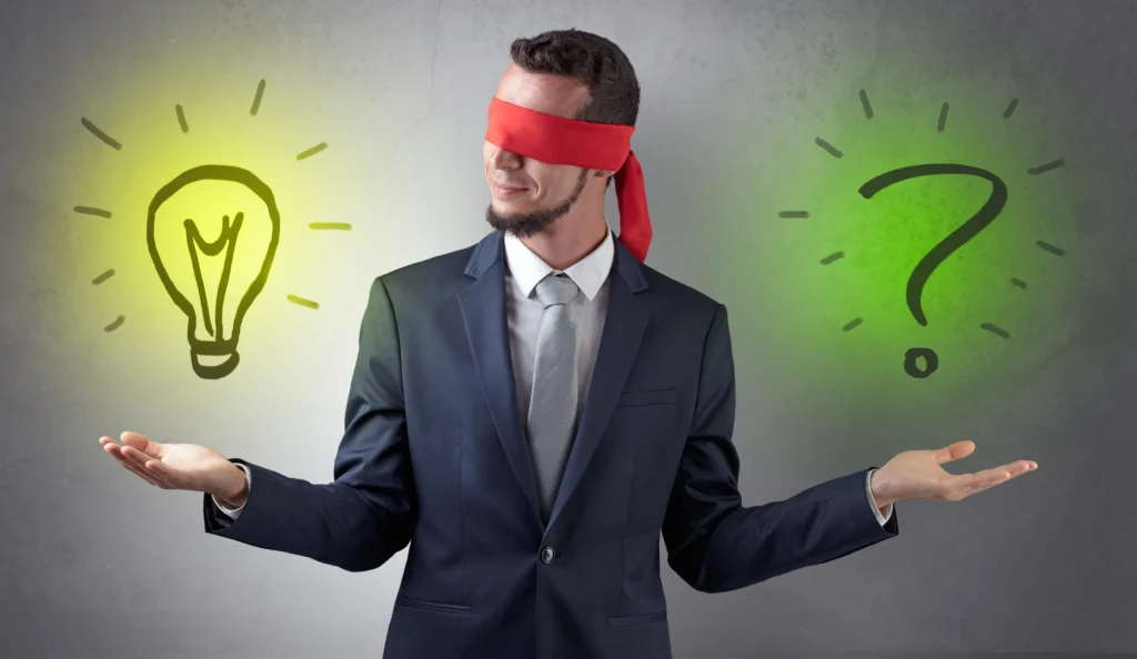 covered eye businessman with bulb and question sign.