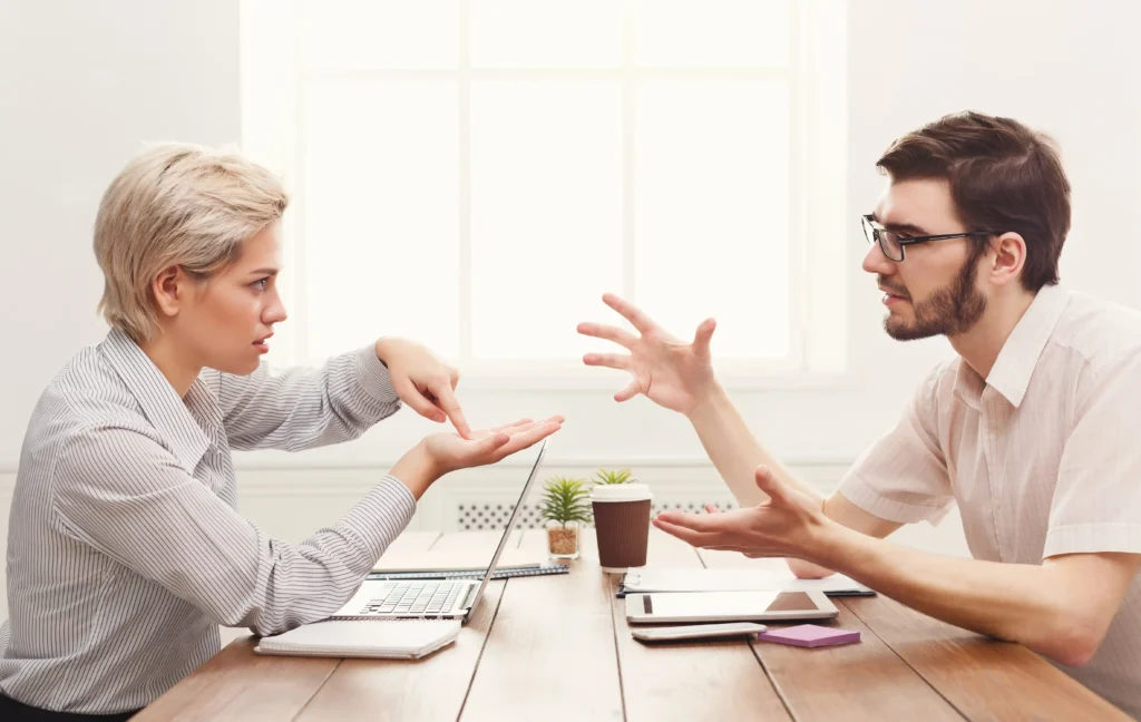 Two Coworkers Communicating and Discussing Work